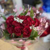1 dozen value roses with some greens and gyp; 