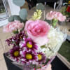 Designers choice mix of flowers in a small bouquet; averages 6-8 stems