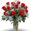 A timeless expression of love. This elegant arrangement features one dozen premium