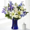 Accented by a deep blue vase, our Calming Comfort Bouquet is crafted