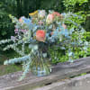 Vibrant arrangement with a color palette of orange yellow green blue. Full