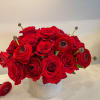 Stunning and fresh red roses and red ranunculus in 6" ceramic vase.