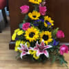 Sunflowers, Roses, Daisies, Static, Snap Dragon, and Stargazer Lilies with mixed greens
