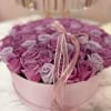 A stunning arrangement featuring 70 premium roses in soft blush and lavender