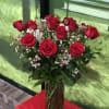 One Dozen rose in vase with filler and greens to make any