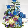 A beautiful array of Designer Choice Blue Rose Arrangement with mixed Spring