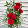 A modern design of 1/2 dozen roses that will lift her heart