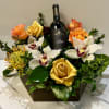 Celebrate with a beautiful box of Cymbidium orchids, mixed greens, roses, and