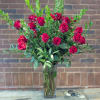 Two dozen exquisite red roses nestled among lush greenery. Perfect for that