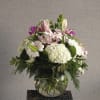 An beautiful arrangement of premium flowers; white hydrangeas and pink lilies accompanied