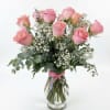 Dozen pink roses in vase