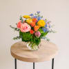 Display your pride with this rainbow inspired flower arrangement! This fun arrangement