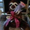 Super soft sloth plush with single stem pink rose