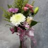 A charming small vase arrangement with soft white mums, graceful pink lilies