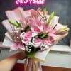 The Blush Elegance Bouquet features a delicate blend of pink lilies and
