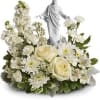 An elegant display of faith and grace, this beautiful arrangement will comfort