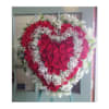 A beautiful solid heart filled with carnations and roses.

Picture is Premium Size.