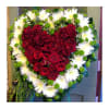 A beautiful solid heart made with lush roses, accented with chrysanthemums. 
Picture