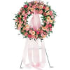This wreath is created with delicate pink and peach blossoms to show