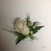 Single white rose with babybreath boutonniere.
