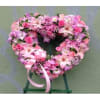 European style heart with colored bow, pink roses and mixed flowers.

Picture shows