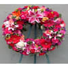 A beautiful and elegant European-style wreath with mixed flowers on an easel.

**Picture