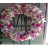 A beautiful and elegant European-style wreath with mixed flowers on an easel.

Picture