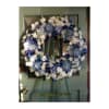 A beautiful and elegant European-style wreath with mixed flowers on an easel.

*Picture