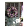 A beautiful and elegant European-style wreath with mixed flowers on an easel.

**Prices