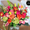 A bright and colorful, lushful arrangement designed in a high quality rectangular