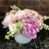 Gorgeous peonies with roses  in a white glass compote vase.

Orientation: All-Around
All