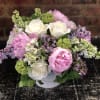 Lilac, Peonies, and White Roses designed in a cylinder vase perfect for