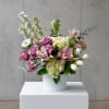 A breathtaking arrangement of premium spring blooms in a harmonious blend of