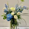 Blue Moon Light is a stunning floral arrangement featuring a harmonious blend