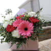 3 red carnations, 3 white carnations, 2 gerbera daisies 