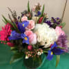 Hydrangea , Roses, Iris, Tulips, Stock, Gerbera Daisies, Spider Mums,  Wax