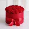 This luxurious arrangement features a stunning collection of vibrant red roses beautifully