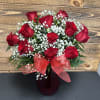 One dozen red roses with baby's breath and greenery