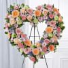 Heart shaped standing spray with beautiful blooms and different styles of flowers