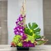 Orchids, bamboo sticks, pompoms.
Ikebana focuses on creating harmony, balance, and a deeper