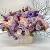 Large, soft, elegant, feminine floral arrangement contains pink hydrangeas, too unique purple