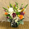 Type of Flowers: Cymbidium Orchids, Ivory Hydrangeas, Orange Roses, White Snapdragons, White