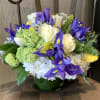 White roses and irises with white hydrangea.