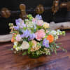 An elegant mix of muted tones. This arrangement is a wonderful gift