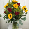 Sunflowers &amp; roses, together in perfect harmony! Accented with decorative greens and