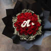 25 Red Roses surrounded by babies breath, wrapped in black lux waterproof