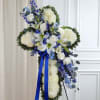 Celebrate a life of faith and devotion with our elegant sympathy arrangement.