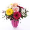 WE TOOK AN ASSORTMENT OF GERBERA DAISYS WITH A LITTLE GREENERY AND