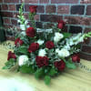 Red roses are featured here in a beautiful sympathy design perfect for