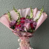 A pastel bouquet is a soft, elegant arrangement of flowers in gentle